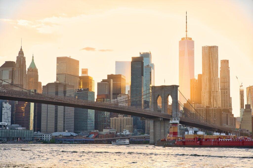 A stunning view of the Brooklyn Bridge and New York City's skyline at sunset.